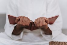 person holding a quran